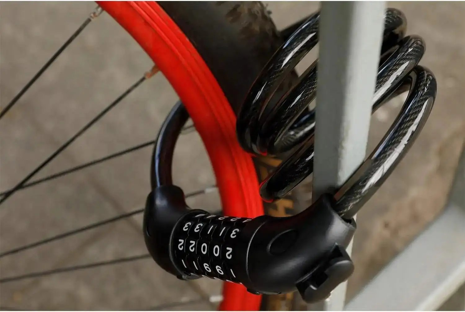 Bike cable lock self-coiled for compact storage