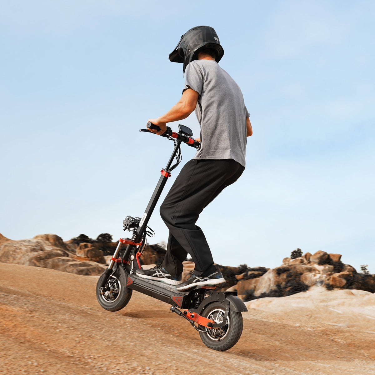 Rider on iScooter iX8 off-road electric scooter on dirt trail